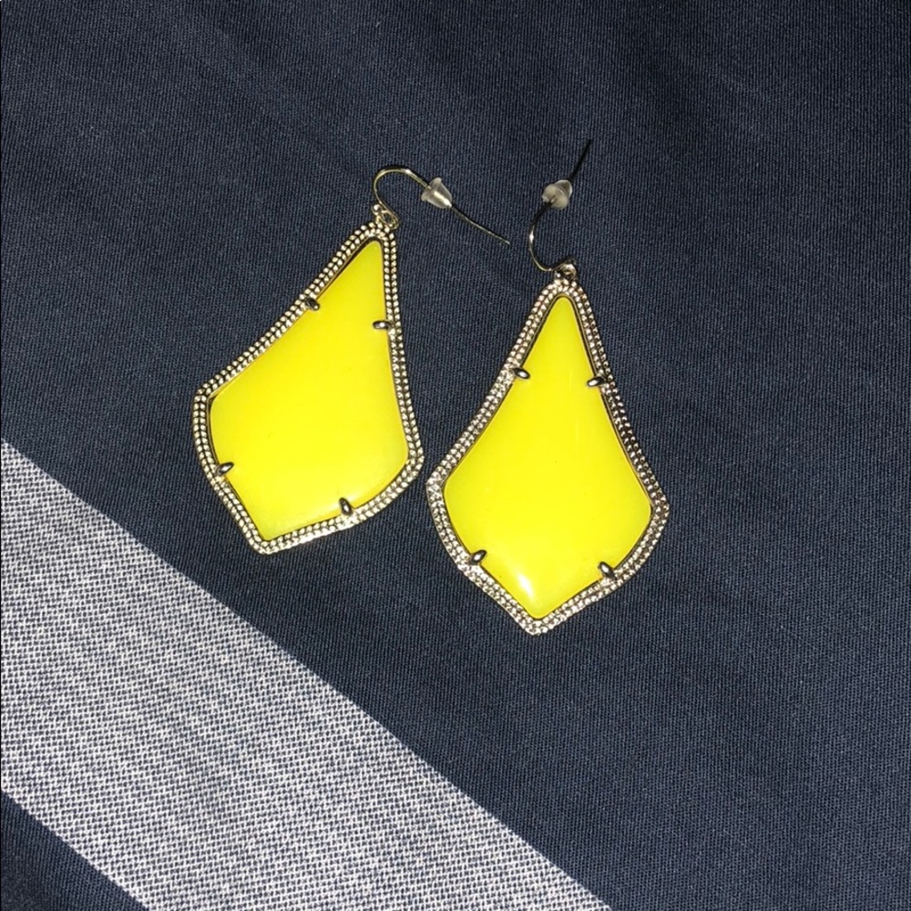 Yellow Kendra Scott earrings.
